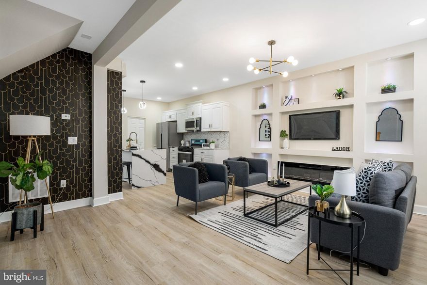 Introducing this stunning fully renovated end-of-group rowhome in Baltimore, offering three bedrooms and 1.5 baths. Step inside to discover brand new LVP flooring throughout, enhancing the home's modern appeal. The living room boasts two accent walls for added character and features a large electric fireplace framed by cutouts on the wall, providing additional shelving space. Seamlessly connected, the living room opens to the kitchen, which showcases white cabinets, quartz countertops, and a decorative backsplash. The island with a waterfall countertop adds a captivating touch to the space. Enjoy dining in the kitchen, where there's ample room for a table, and appreciate the convenience of a powder room and laundry room nearby. Upstairs, three spacious bedrooms await, along with a full bathroom boasting a tub/shower combo and tile surround. The lower level presents an unfinished space, offering endless possibilities for customization and personalization. Outside, entertain guests in the partially fenced backyard, creating the perfect setting for summer BBQs and gatherings. Convenient to Sinai Hospital, 83, 695 and the Inner Harbor Don't miss the chance to make this beautifully renovated rowhome your own! Schedule your showing today!