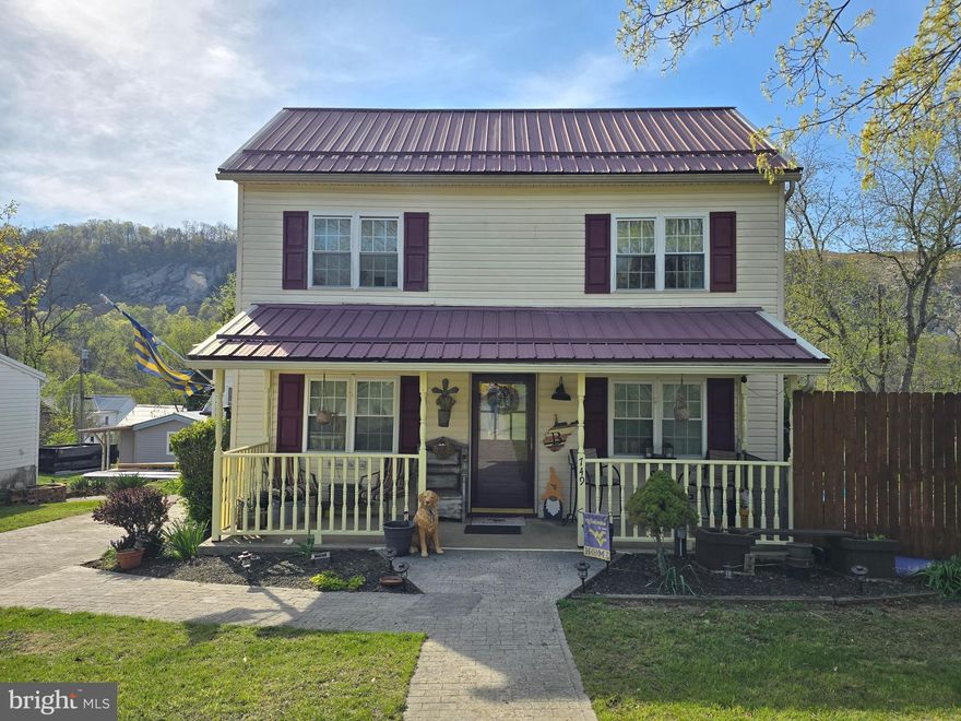 WELL-MAINTAINED 1900s COLONIAL!!! This 3-bedroom, 2-bath home is situated on .3 acres, conveniently located just outside downtown Berkeley Springs/Town of Bath. The property features public water and sewer, a spacious backyard, an above-ground pool, a metal roof, a front porch, a rear deck, off-street parking via a concrete driveway, and much more!  Enjoy your privacy with the primary suite (bedroom/bathroom and side porch access) on the main level, just off the kitchen, while your guests/relatives have their own bedrooms and a full bath on the upper level. The eat-in kitchen is equipped with a dishwasher, fridge/freezer, and gas cooktop range.  Just off the kitchen is a small laundry/mudroom with exterior access.  An open living room/dining room provides plenty of space for entertainment.  This charming home is a MUST SEE!