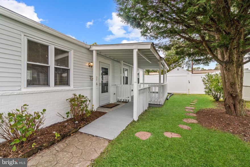 This charming one level ranch style home was created for gracious everyday living with well-appointed spaces and classic design. Completely remodeled in 2017 – including central HVAC, new hot water heater, gleaming hardwood floors, new windows, and updated bathrooms. Additional updates include a new roof and professional landscaping (2020) as well as fresh paint both inside and out (2023). The home presents an inviting open floor plan with a stylish dining room that opens to a well-appointed kitchen. The updated kitchen features granite countertops, design-inspired backsplash, stainless steel appliances and French doors that lead to the back patio.  A spacious living room is conveniently located off the dining area, and is filled with natural light.  The home hosts three large bedrooms including a primary retreat with ensuite bathroom with a glass-enclosed shower with a beautiful tile design.  The hallway full bathroom has been tastefully updated and features a tiled shower/tub.  A large stacked washer and dryer in the hallway offer convenience and ease of use.  The exterior has been beautifully updated with fresh paint and new shutters (2023).  Enjoy the lovely, fully vinyl fenced backyard (2018) from the large patio or covered deck, perfect for entertaining and relaxation. The new vinyl shed (2022) with electric, insulation and finished walls holds endless possibilities for a hobbyist or as a private home office. A long driveway provides ample off-street parking. The convenient Harundale location, with close proximity to the County Library, offers easy access to shopping, restaurants and more, as well as commuter routes to Baltimore and Annapolis.