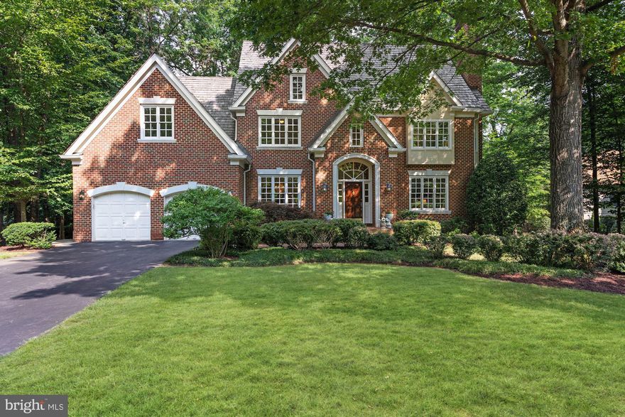 Stunning brick colonial in the prestigious Avenel community. Situated on a lush .65 acre private lot this home features over 5,000 square feet of living space with 5 bedrooms and 4.5 bathrooms with an attached 2 car garage. The main level features a grand 2 story foyer with hardwood flooring throughout. Off the foyer is the formal living room with cozy wood burning fireplace and tons of natural light. Entertain in style in the formal dining room with custom mill work and tray ceiling details. The gourmet eat-in kitchen features top of the line stainless steel GE Monogram appliances, granite counters, and a breakfast bar. You also have double ovens and an additional prep sink within the island. Off the eat-in area you have a built-in bar with wine rack and a built in work station. The sunny morning room is just off the kitchen with atrium windows, skylights, and leads out to the huge back deck overlooking the trees and yard. The main level also includes a private office with deck access and a family room with a stone gas fireplace. The upper level includes 5 spacious bedrooms and 3 bathrooms. The master bedroom retreat features another wood burning fireplace, tray ceiling detail, and walk-in closet. The master ensuite bath features a vanity with double sinks, a soaking tub, and a large tile shower. The lower level includes additional rec space with a stone fireplace, full bath, and tons of storage space. You also have a walk-out to your large stone patio and backyard with a built in basketball court. Ideally located within minutes to major commuter routes, shopping, and restaurants. Desirable location for both public and private schools. Living within the Avenel community includes many benefits such as a private Clubhouse, 3 pools, and 6 tennis courts. The Avenel Park is also located within the community with playgrounds, basketball courts, and jogging/walking paths. For equestrian lovers there is also a privately owned horse stable and riding facility. To top it off TPC Potomac at Avenel Farm has a PGA acclaimed 18 hole private golf course and club. Don't miss the opportunity to live in this luxury residential neighborhood. Virtual tour available at www.Darthomes.com.