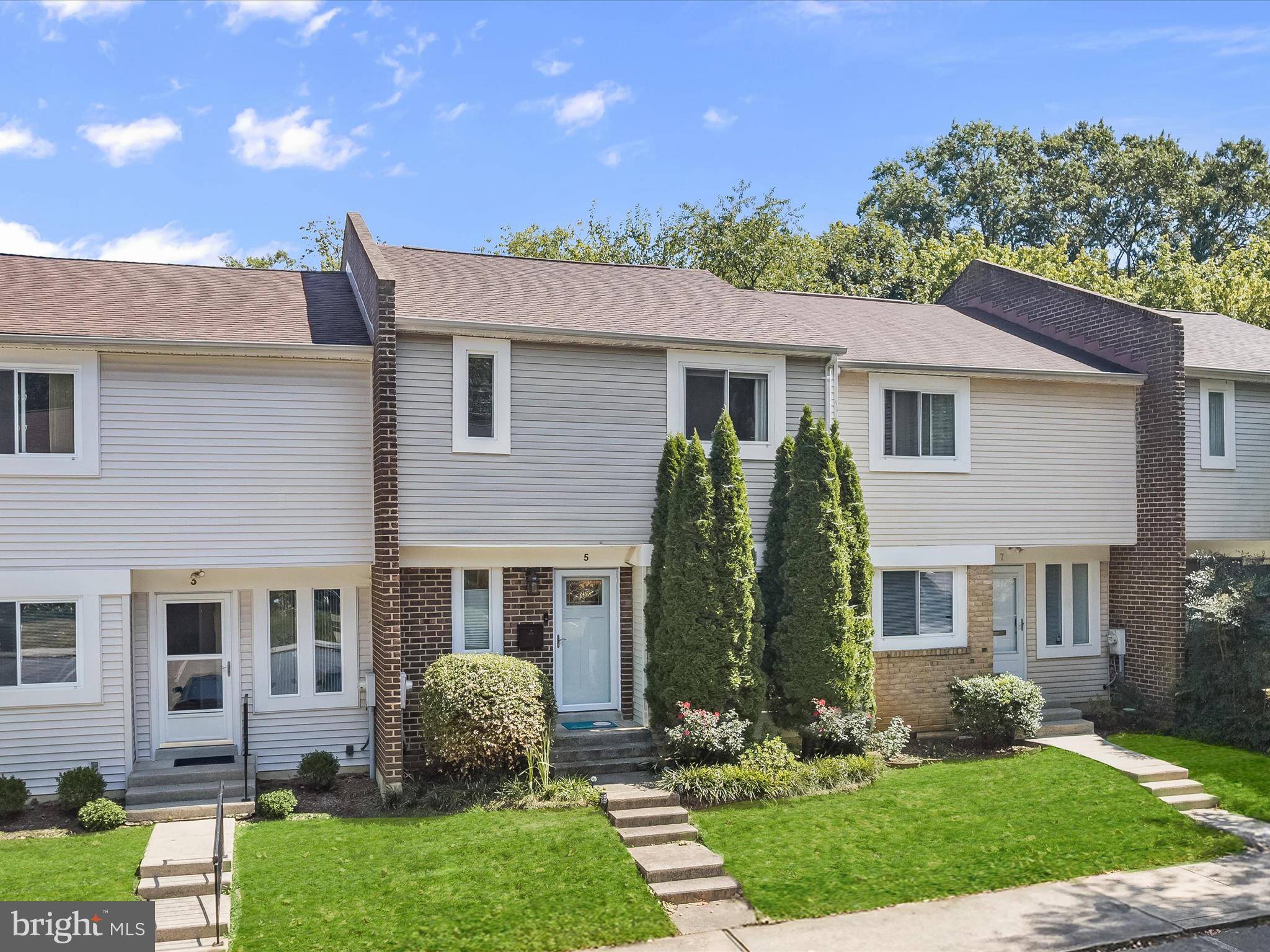 Tucked within The Landings community, this three-level townhome blends thoughtful updates with a convenient location and access to a wealth of amenities, including two community pools, tennis courts, and pickleball courts. An open concept floor plan welcomes you inside, where modern touches and character details create a warm and inviting atmosphere. To the right, the kitchen offers Silestone counters, stainless steel appliances, ample workspace, and a breakfast bar that makes both cooking and entertaining easy. Beyond the kitchen, the dining space flows naturally into the living room, anchored by a wood-burning fireplace with a reclaimed art deco-style mantel and a travertine hearth. A sliding glass door extends the living area to a composite deck, surrounded by mature trees that provide natural shade and privacy. Upstairs, the primary bedroom impresses with its generous size and a wall of closet space. A private vanity area complements the ensuite design, leading into a water room with a toilet and a tiled shower that has been enhanced with a row of aqua accent tiles and extended tilework that now reaches the ceiling. Two additional bedrooms and a full hall bath complete the upper level. The lower level expands the home’s flexibility with a partially finished space that can serve as a recreation room, exercise area, hobby space, or storage. A sliding glass door opens directly to the backyard, while a large laundry area and under-the-stair storage with custom doors add everyday convenience. Recent improvements include a roof in 2019, refinished lower-level stairs, updated light fixtures, a reclaimed mantel, and travertine landings, ensuring style and peace of mind. The Landings community maintains lawns, common areas, and snow removal, making low-maintenance living possible. Parking is unassigned, yet there are ample spaces available for both you and your guests. This location offers the best of Annapolis at your doorstep. Downtown Annapolis is only a few minutes away, providing waterfront dining, historic landmarks, and cultural attractions. The Pip Moyer Recreation Center and Truxton Park are within walking distance, while Quiet Waters Park offers 340 acres of trails, water access, and a dog-friendly beach. Blending modern updates, a flexible layout, and exceptional amenities, this townhome provides both comfort and convenience in a sought-after Annapolis setting.