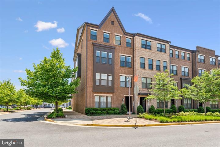 Gorgeous 3 bedroom, 2.5 bath end-unit townhome condo with one car garage in the highly sought-after Kincora neighborhood in Sterling.  The main level features an open floor plan with loads of natural light shining through the huge kitchen, which includes white quartz countertops, a designer kitchen package with a huge island, pendant lights, stainless steel appliances, double ovens with gas cooktop, side by side refrigerator, built-in microwave, and beautiful hardwood floors. The family room features a contemporary elongated gas fireplace with a remote control and provides access to a balcony. The luxury primary suite boasts a walk-in closet and a luxury bath with tile flooring. The two additional bedrooms are spacious with ample natural lights and closet space.  The home also includes a 240V electric car charger in the rear load garage.  Just off Rt 28 and minutes from the Silverline Metro, very close to One Loudoun and few miles drive to Dulles International Airport. MUST SEE!!  Available NOW!!