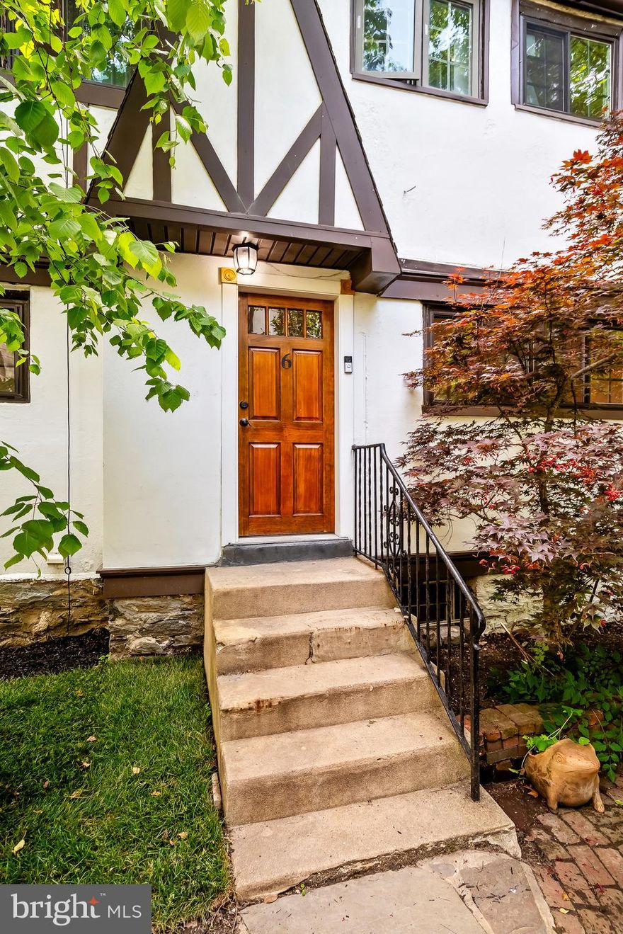 Don't miss this 4-bedroom 2.5 bath Tudor home in a charming Cul-de-sac located in in the Award-Winning Lower Merion School District.  Enter into the bright living room with beautiful hardwood floors with built in bookshelves and a wood burning fireplace.  There is an open dining room and kitchen with granite countertops, stainless-steel appliances and a convenient adjacent laundry room.  Sitting off the dining room is a cozy office with exposed beams and French doors leading to a deck.  The second floor has 3 bedrooms and a newer full bathroom.  The third floor makes a great primary suite with a full bath and French doors to a balcony.  There is a half bath on the lower level.  There is a large shared green space. .    Very close to dining, shopping, major roadways. Walking distance to regional rail for an easy commute to Center City.