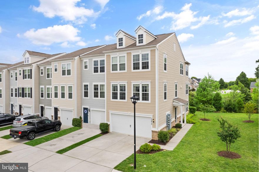 This meticulously maintained end unit townhome, with three-level bump-outs is one of the largest homes in the community. Ideally situated in a sought-after neighborhood with easy access to Route 1 and I-95, it combines the advantages of convenience and spacious living.  Convenient to Quantico, Fort Belvoir and the Pentagon.

You'll love the open open floor plan with striking hardwood floors and a host of thoughtful upgrades. The entry level features a tiled foyer and a generously sized rec room with a walk-out to a covered patio area, offering a versatile space for various activities.

The kitchen, a haven for the cook, showcases beautiful cabinets, an expansive island, stainless steel appliances, granite countertops, and a subway tile backsplash, creating an inviting atmosphere for both cooking and dining. You'll find both a formal dining area and a separate eating area within the kitchen, catering to diverse dining preferences.  Also has ample space for an office.  Step outside to the composite deck, where you can savor a tranquil wooded view while enjoying the outdoors.

The spacious family room, bathed in natural light, is a delightful hub for gatherings, providing a warm and welcoming ambiance.

Moving to the upper level, you'll find 3 well-appointed bedrooms, including an owner's suite that exudes comfort and luxury. This suite boasts a generously sized walk-in closet, a sitting area, and a tiled owner's bathroom, creating a serene retreat.

Practicality and convenience  with the oversized 2-car garage, ensuring ample space for parking and storage. The private side entry and the backyard overlooking wooded surroundings enhance the  tranquility of this residence.

This townhome strikes a perfect balance between space, style, and convenience, all within the backdrop of a highly sought-after location. Seize the opportunity to make this amazing property your own and experience the best in contemporary living.    Move in ready!