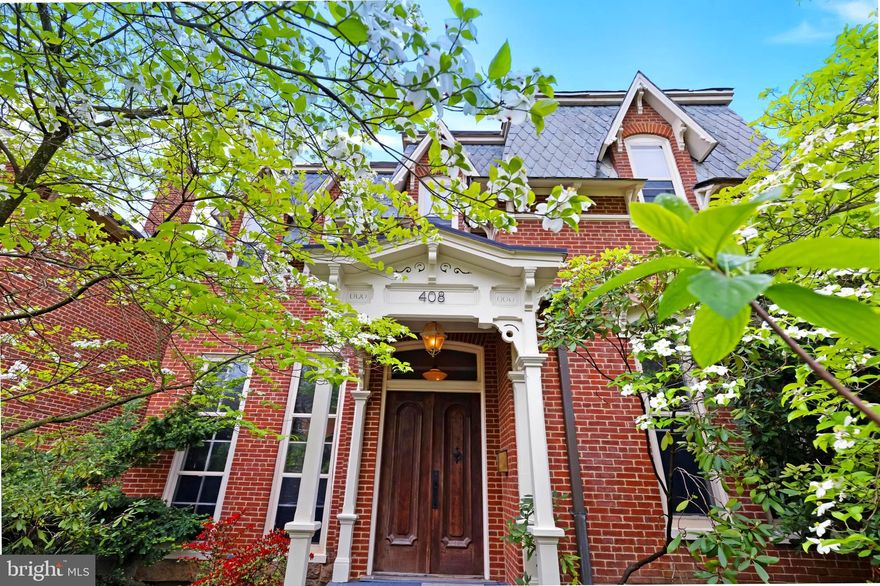 Built in 1875, this gorgeous historic home is one of only a handful of traditional Second
Empire style homes in the area. With its distinctive mansard style slate roof and
exquisite double door entryway, the interior of the home is a cozy, modern & elevated
space featuring original hardwood floors, an incredible floor-to-ceiling see-through brick
fireplace, a lovely front entrance staircase, large floor-to-ceiling windows, and
wonderfully high ceilings. The main level has a sweet open kitchen connected by a two-
way fireplace to a dining/living area and across the hallway is another spacious room
perfect for dining/lounging & a baby grand piano. A full bath and large laundry room sit
at the back of the house with exits to the rear porch. The front entryway includes a
closed in foyer which is perfect for storing shoes, jackets & backpacks and helps keep
winter weather outside. The upstairs boasts four bedrooms - two with fireplaces, a full
bath, extra wide hallway, and a back studio space which connects to the downstairs
laundry room by a rear staircase. The home has two unfinished stone basements and
ample storage space. Heating is by natural gas radiators and cooling is by window
units. There are two lovely rear porches shaded by a stately evergreen magnolia tree,
perfect for summertime “porch hangs.” A cute grassy backyard space is perfect for
bocce ball and picnics and a detached garage offers ample space for a creative studio,
outdoor gear and bicycles. Living on Washington Street is super dreamy! The beautiful
historic homes lining this street reflect the city’s rich history as the Queen City and you
are just minutes away from world class hiking & biking trails (think C&O Canal Towpath
& Great Allegany Passage) and a hop, skip & jump away from a day floating down the
Potomac River or swimming at Rocky Gap State Park. You can easily walk to
Cumberland’s historic city center, filled with hip restaurants, bars, cafés, and retail
shopping, and if you’re into craft beer, several award-winning breweries are nearby.
Within an hour’s drive is New Germany State Park, Deep Creek Lake and the Wisp ski
resort. With four seasons of outdoor recreation, and easy access to major metro areas
like Pittsburgh, Washington, DC, and Baltimore, Cumberland is definitely the place to
be!