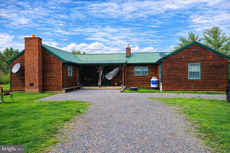 Don't Miss This One for Residential or Commercial Use!  **Seller is Motivated**.   Zoning is GU-R and was previously zoned Commercial.  The possibilities are endless with this property.  The property was once an antique shop and a profitable Airbnb as a large source of income.   This charming 1953 ranch-style home offers a perfect location bordering I68, Exit 56 and only 5 miles to Rocky Gap State Park, Golf Course, and Casino.  This home is a perfect blend of comfort and functionality, nestled on a spacious 1.1-acre lot.  Step inside to discover an inviting open floor plan adorned with beautiful hardwood floors and ample natural light and lighting fixtures.  The heart of the home features a well-appointed kitchen with a wood-burning fireplace and butler's pantry, ideal for culinary enthusiasts.  Enjoy cozy evenings by the gorgeous propane fireplace.  You can snuggle up in the bedroom with a good book and electric fireplace adding warmth and character. The main level includes 1.5 baths, 3 outside exits, 4, entry-level bedrooms.  While the partially finished basement provides space for an additional bedroom with a 4th fireplace,  laundry area, workshop/man cave or recreation area.  Outside, the property boasts a level yard with stunning mountain and valley views, perfect for outdoor gatherings or peaceful retreats. With a convenient attached garage and ample driveway parking, and a shed, and 3 sewage hook-ups this home is designed for ease of living or conversion back to a commercial space.  The home was remodeled inside and out in 2012 including a metal roof.  There are T/G pine walls and hardwood floors throughout.  Experience the tranquility of this delightful residence, where every detail invites you to create lasting memories.  Numerous commercial opportunities exists and once as a financial successful Airbnb  The potential is here and waiting for a new residential or commercial owner!  Call for your appointment today!