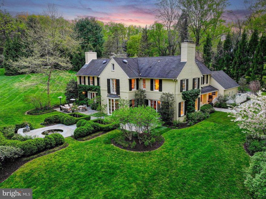 Live authentically. Nestled atop one of Greenspring Valley’s most coveted streets, lies this unmatched beauty by Charles Nes, originally designed for his brother, circa 1968. A timeless appeal sited on a lush 4.46 acre lot and further elevated by a carefully considered complete house update envisioned by Henry Warfield Architects. A masterful blend of enduring architecture and modern comfort while staying true to its roots. Grand proportions, high ceilings, exquisite millwork, stunning fireplaces and deep windowsills all beckon you back in time. True craftsmanship, curated materials, and functional design are evident throughout renovations. Magazine worthy kitchen with custom cabinetry, honed Calacatta marble, Subzero refrigerator and Rohl faucets. Step upstairs to primary retreat wrapped in windows and flooded with natural light. Carrara marble drenched bathroom, complete with heated floors, leaves little to be desired. With four additional bedrooms and two bathrooms, the second floor offers a rare opportunity for five bedrooms all together. Stunning French doors open to thoughtfully imagined gardens and pond by Stone Hill Design. Listen to the sound of the fountain…total tranquility in a storybook setting. A rare gem in the heart of the Valley. Showings begin at Broker's Open, Wednesday, April 30th, 12:00-3:00. Cultivate your existence. The art of uniting human and home.