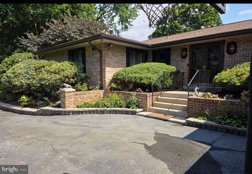 Welcome to this beautifully  well-maintained single-family home nestled on a serene 1.3-acre lot. Built in 1978, this charming residence offers a spacious and functional layout with 2 finished levels that features 3 bedrooms and 2.5 bathrooms all on the main level, not to mention the awesome window filled sunroom!!

The main level showcases a bright living room with a wood-burning fireplace,  a traditional kitchen with ample cabinetry and workspace, a formal dining room that also includes a wood burning fireplace that creates an inviting, intimate atmosphere that enhances every occasion, making the space feel cozy and timeless, , The primary suite includes a private full bath, while two additional bedrooms with one having  wheel chair access to outdoors and  share a full bathroom,  Then Main Level also includes a  laundry area,  a half bath. Enjoy year-round outdoor living in the glass enclosed  sunroom, ideal for relaxing or entertaining.to complete the main level

The lower level offers a large recreation room and possible in-law suite and kitchenette with a versatile bonus area that includes a third fireplace, and utility room—perfect for a home office, gym, or guest space.

Additional highlights include an attached 2-car garage, plenty of driveway parking, and expansive outdoor space surrounded by mature trees, and manicured gardens enclosed with  a 3 rail fence supported with chain-link in backyard offering privacy and security for children and pets,  endless potential.  Lets not forget the piece of mind of having a backup auto switch generator ensuring uninterrupted power to appliances and other light fixtures during those outages keeping your home essentials systems running smoothly.  The outdoor shed comes with electricity inside and out turning it into your potential exterior workshop.

Conveniently located near commuter routes, shopping, and schools.  This home combines comfort, character, and convenience in a peaceful setting, and timeless appeal and is truly rare find!!