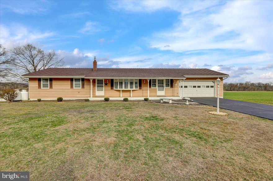 This charming home offers 3 bedrooms and 2 bathrooms, along with a lovely sunroom that provides serene views of the surrounding landscape and stunning sunsets. Step outside to a cozy yard, perfect for relaxation or gardening. Inside, the spacious living room is ideal for both unwinding and entertaining. The basement features a versatile room with a closet and window, offering potential as an in-law suite or rental unit. Additionally, a separate workshop area provides endless possibilities for storage or hobbies. Don’t miss the chance to make this inviting retreat your own!