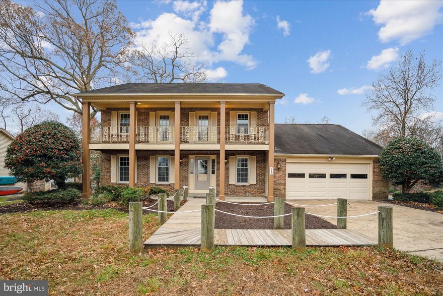 ANNAPOLIS LANDING WITH WATER VIEWS! This beautifully updated Colonial is move-in ready, with freshly remodeled baths, new paint, and thoughtful updates throughout. The home features hardwood floors, crown molding, and chair rail, along with an updated Kitchen with an island. The Family Room boasts a gas fireplace, vaulted ceiling, and bar area, with access to the Deck. The Primary Bedroom Suite offers a Sitting Room with stunning water views. The full, walk-out Basement with rough-in (plumbing) has endless possibilities. I can't wait for you to see it!
