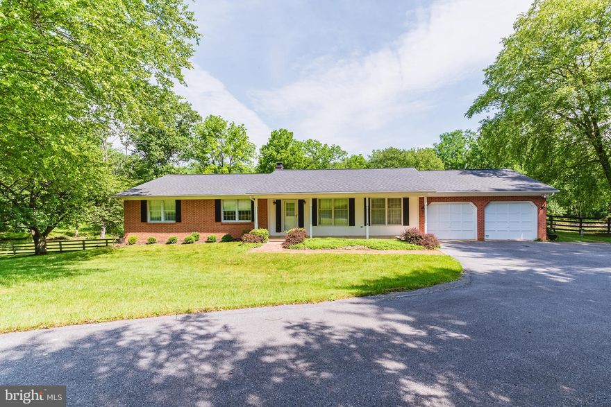 HUGE $30K PRICE REDUCTION!!!! You will love the bucolic setting of this home in the highly sought after Greencroft community. The property is located at the end of a private drive surrounded by HOA land and features a 0.75 acre pond fed by a year-round stream.  The well maintained brick front Rancher has a 2 car attached garage including additional storage space. The house features a  spacious living room/dining room combination that is perfect for entertaining.  The family room off of the kitchen has built-ins and a wood burning fireplace. The kitchen boasts a breakfast nook again providing gorgeous views of the rear yard and pond.  There are three spacious bedrooms and hardwood flooring throughout the main floor.   Sliders lead to a deck overlooking the pond. Partially finished lower level with walk-out, cedar closet and endless possibilities.  The dam is  on HOA property but the owner of this property is responsible for maintenance.  New boundary and wetland surveys completed (see documents).  2012 John Deere Tractor with mower deck/snow blade attachments along with a Yardman snow blower convey with the property. Enjoy relaxing days fishing at your own private stocked pond. Nature living at its best.  Rarely available community pool. Minutes to Hunt Valley Towne Centre and I83.