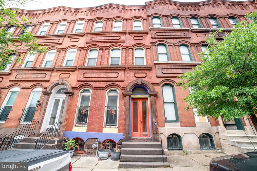 Turnkey 3-unit brownstone in Station North with documented $48,269 T12 gross income and active Baltimore City rental license through January 2028. Three separately metered 1BR/1BA apartments, all updated with stainless appliances, gas ranges, dishwashers, and modern flooring. Each unit independently metered for gas, electric, and water heater. Brand-new roof. HVAC in good working order. Lead paint certifications in place. Rear parking pad. Approximately 3,700 sq ft across three finished levels in an 1890 historic brownstone with original character preserved. Unfinished basement combined with flexible OR-3 zoning supports a future fourth-unit conversion (not currently plumbed); stabilized rents at four units project to roughly $5,900/month. Walking distance to Penn Station (Amtrak Acela, MARC, Light Rail), MICA, University of Baltimore, and Johns Hopkins shuttles. Quick access to I-83 and the Inner Harbor. Full T12 and rent roll available upon request.