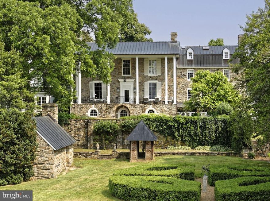 Rockburn Farm - Tucked along a quiet gravel road is this idyllic 132-acre farm anchored by a classic 10,000+ square foot estate house originally built in 1828 by the Glascock family and lovingly restored by the current owner.  The preeminent stone manor house has had many additions over time added by previous owners such as Hubert B. Phipps and Thomas Mellon Evans. With no details spared, it now boasts 7 bedrooms, 8.5 bathrooms and 8 fireplaces with stunning views of the Blue Ridge Mountains. Notable Washington DC architect Merle Thorpe oversaw the extensive renovations and the house offers an understated elegance that combines both formal rooms along with comfortable family spaces.  The large portico off the back of the house provides a wonderful area for entertaining. The surrounding gardens and plantings were brought to life by landscape architect Michael V. Barlett and by local landscape designer Nicole Seiss. Dotted amongst mature hardwood trees are old stone walls with lush garden beds, an ornamental water garden, boxwood parterre and a pond.  Near the main house is a two-story log cabin and a one room stone summer kitchen. Other outbuildings include four tenant houses, a greenhouse, two separate horse barns with 15 stalls each, over 12 fenced paddocks many with run-in sheds and two workshops. Located within the Piedmont hunt territory with tremendous ride out. The property is located within the Cromwell’s Run Historic District and is protected by a Virginia Outdoors Foundation (VOF) Conservation Easement. A property with the historic provenance such as this does not come on the market very often. This is a rare opportunity to live in one of the Middleburg areas most prominent estates.