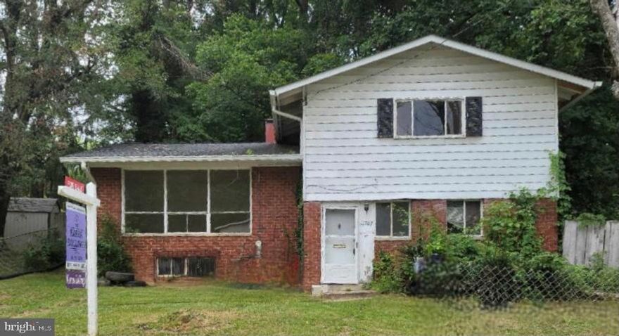 Diamond in the rough. Priced to move! Take a walk down this quiet, quiet street and feel the great outdoors along Rock Creek Park and enjoy the babbling brook!  You cannot beat this quiet tranquil setting!!  Home features good bones, but this one needs a face lift!  Four level split with 3 Bedrooms on the second upper level and one bath that needs to be renovated  Main level features half bath, living room, dining area and kitchen that needs to be renovated. First upper level features a living room which opens to den and future patio area and quiet back yard. The basement has its own private entry and could be rented out separately for additional income. Come out and see this home before it is sold, and make it yours!