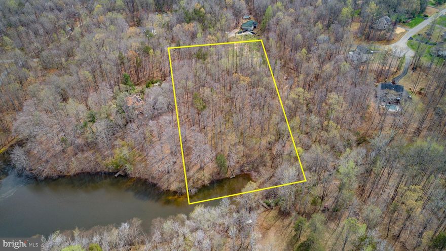 It doesn’t come along often, but here’s a rare 5-acre parcel off Gordon Road, just 5 miles from Route 3. The small community of River Will is comprised of only 37 five-acre homesites, offering space and privacy that’s hard to find. This wooded lot, filled primarily with hardwoods, slopes gently down to the water and is an ideal setting for a walkout basement. Several of the lots surround a beautiful pond, creating a peaceful setting where access is limited exclusively to the homeowners who live along its shores. With abundant wildlife and a serene natural backdrop, this is a perfect place to build your dream home.