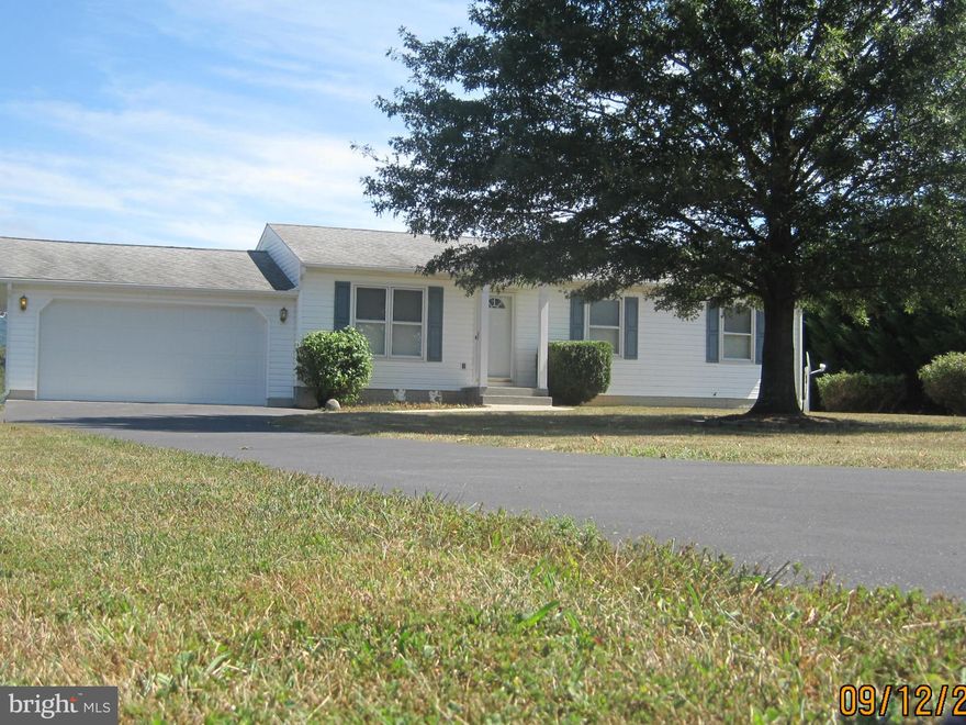 Man space aplenty! Huge detached garage for all kinds of storage or projects, garage doors front & back! Oversized doors in the front.! Charming rancher, ready to make your own. Country setting beckons the world weary, 2 acres - mostly unrestricted.Relax on the rear covered porch, property edges in cyprus. Large master bedroom Gleaming wood floors in the entry/diningrm.