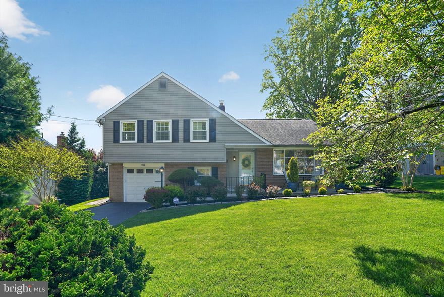 Welcome to 962 Edwards Drive, a picture‑perfect 3‑bedroom, 2.5‑bath split‑level home offering over 2,600 square feet of living space in the highly desirable Springfield School District. This home is truly 100% move‑in ready and shows beautifully from top to bottom.

As you arrive, you’ll immediately notice the manicured landscaping, exterior lighting upgrades and inviting front patio that set the stage for what’s inside. Step into this bright and sunny home featuring a spacious living room with a large picture window and hardwood floors that continue into the formal dining room. The updated eat‑in kitchen boasts tons of cabinetry & storage, granite countertops, tile flooring, and a full appliance package—all updated within the last two years. The kitchen overlooks the breakfast area with sliders leading to the rear deck and flows seamlessly into the expanded family room addition, complete with a gas fireplace and storage.

The lower level offers yet another comfortable living space featuring a wood‑burning fireplace, outside entrance, powder room, laundry area, and access to the one‑car garage.

Upstairs, you’ll find a spacious primary bedroom with two large closets and a private, fully tiled bathroom. Two additional bedrooms, each with large closets and hardwood floors, share a hall bath. This level also provides access to a walk‑up attic with abundant storage.

The fully fenced backyard offers exceptional privacy with mature plantings and plenty of space to relax or entertain outdoors. Ideally located in the Springfield School District, this home is just steps from Crowell Park featuring picnic areas, ball fields, tennis courts, and a playground, as well as nearby restaurants, shopping, and major transportation routes to Philadelphia, Wilmington, and Philadelphia International Airport.