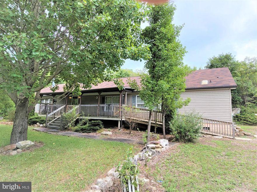 Located on 6+ acres, this 3 Bedroom/3 Bath home provides one-level living.  With an open floor plan, the family room is just off the kitchen.  Plus, there is an additional living room/den.  The large master bedroom features a huge walk-in closet and 2 separate bathrooms, one having a walk-in tub and the other a shower stall.  Two detached garages provide space for parking, storage, or a workshop.