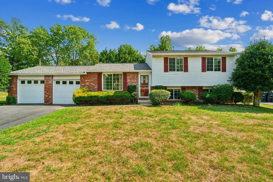 This beautiful 4-level split home features hardwood floors and is located in a cul-de-sac with meticulously maintained lawns. The home offers four flexible levels with a rec room, family room, office, bedroom, and storage space on the two lower levels, allowing you to customize the use of the ample space to your liking. The home also includes a spacious driveway with a 2-car attached garage. The contemporary kitchen is equipped with stainless steel appliances and granite countertops, and it has a pass-through to the well-lit dining room. You can step out from the dining room through the sliding French doors onto the brick patio and into the large backyard. The home's prime location is unbeatable, with close proximity to a public school, various shopping destinations, the National Harbor, and the bustling heart of Washington D.C. The roof was replaced 5 years ago, and a modern water filtration system is included. Come and see this lovely home and fall in love with it!