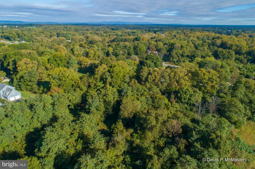 One of two adjacent lots hilltop lots about 1.5 miles from Shepherdstown WV.;  University Town, nice restaurants, shops. Near the Potomac River. Part of a well established, attractive community of quality, larger homes.  See  other listing for adjacent Lot 16.   Convenient location for commuters. . 20 minutes to Marc Commuter Train to DC.