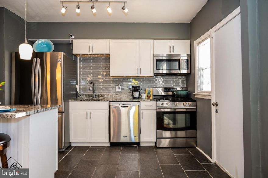 Welcome Home! Spacious three bedroom 2 full bath home with Stainless steel Appliances. Gas Stove,  Granite Counter tops, Hardwood Floors, Finished Walk-out basement with vinyl flooring. The backyard is fenced in, with lush green grass. Perfect for your pet! Additional parking in back of home. Neighborhood Hotspots, Shops in Catonsville, Close to Baltimore Harbor and Interstate 95. This feels like home, come see for yourself!