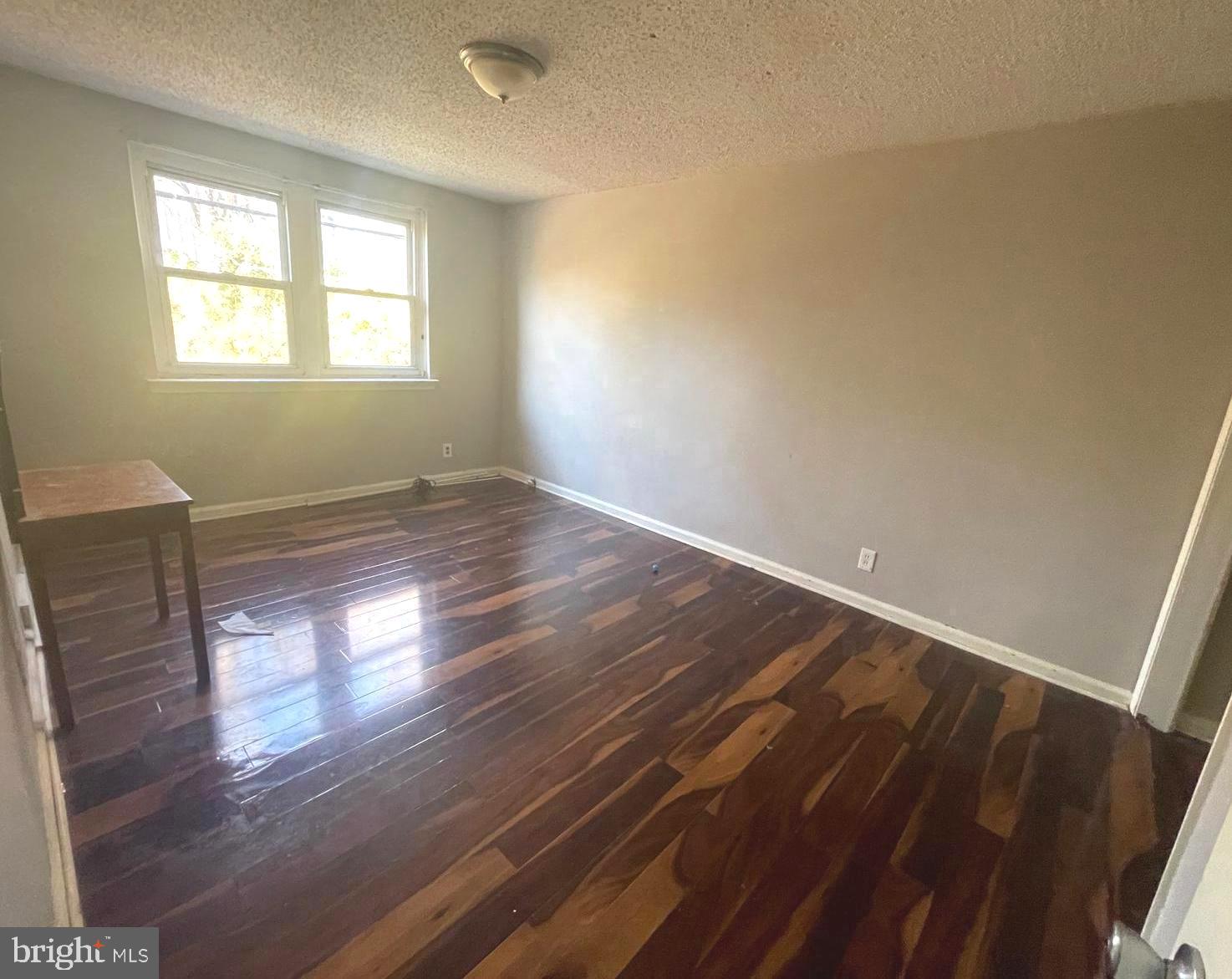 This solid masonry triplex offers a fantastic opportunity for investors or owner-occupants seeking a fully functional multi-unit and income-generating building in a prime location. Currently fully occupied, the building brings in nearly $3,000/month in rental income. Each unit is separately metered and features durable construction with a flat roof, circuit breaker electrical system, and public sewer access. The property is equipped with natural gas heating via forced air and electric cooling, ensuring year-round comfort and convenience for tenants. Whether you're looking to expand your portfolio or occupy one unit while renting the others, this well-maintained triplex is a smart and versatile investment - schedule your showing today!