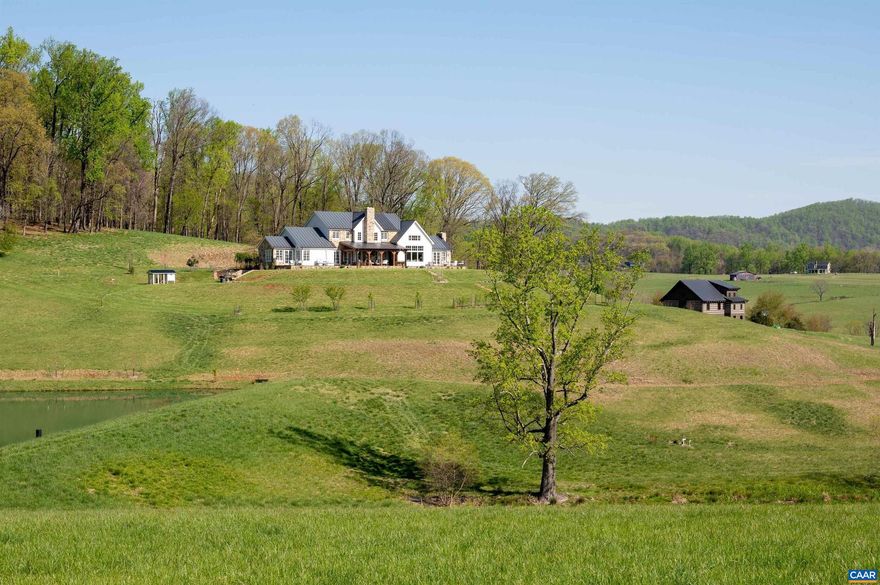 Entered in for Comp Purposes.  This magazine worthy farmhouse is perfectly sited on over 156 protected acres overlooking a pond and the rolling hills of Southern Albemarle. With dramatic yet warm and welcoming interior spaces, this home is truly stunning! 4 bedroom, 4 full and 2 half baths, gorgeous professional kitchen, luxurious his and her primary bathrooms, a cozy den, and a light-filled great room with dramatic cathedral ceiling and post and beam architectural feature. The owners' uncompromising standards and attention to detail are evident both inside and out with features including shiplap interior walls, beautiful hand-hewn timber on cathedral ceiling, posts and beams, stone fireplaces, stone front facade, covered rear patio with exterior fireplace, and superior quality materials and finishes throughout. Enhancing the main residence is a charming log "barn" with full kitchen, bedroom, bathroom and tons of open space which could be used for an office, recreation, guests, or gatherings with friends and family! Great location less than 10 miles south of Charlottesville.,Marble Counter,Painted Cabinets,Fireplace in Den,Exterior Fireplace,Fireplace in Family Room