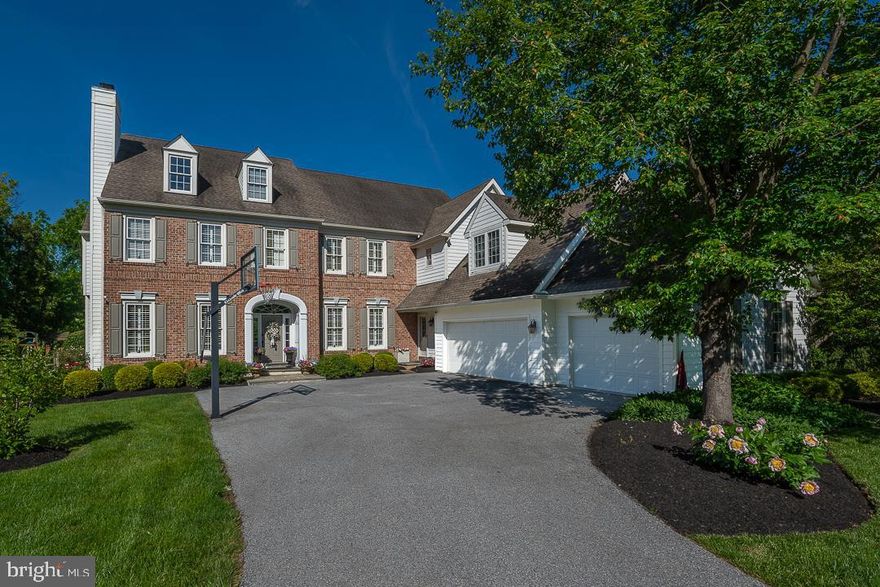 Welcome to 4 Fetters Mill Drive, a rare opportunity to own a stunning classic brick estate home in the sought-after community of “Fetters Mill” in Malvern. This custom-crafted home is situated on a private lot backing to open space with spectacular views from every window and offers mature landscaping and beautiful outdoor living featuring a generous-sized deck and renovated inground pool. This home showcases over 5,800 square feet of living space in 5 Bedrooms, 5 full Baths 2 half Baths and a professionally finished walkout Lower Level. Additional amenities include new lighting fixtures, hardwood flooring, polished Italian Carrera marble in baths, new stainless appliances, new granite countertops and tile backsplash, new driveway, 3-car garage and sprinkler system. Step inside the magnificently handcrafted space to a grand front-to-back Foyer that sets the tone for a sophisticated yet comfortable floor plan with 10’ ceilings on the Main Level. Extensive custom millwork and rich hardwood floors run throughout the rooms on the Main Level featuring formal Living Room with marble surround Fireplace and formal Dining Room with wainscoting. A handsome Study with custom built-ins overlooks the spectacular backyard and a formal Powder Room & closet are tucked into the rear front entry area. The heart of the home is the Gourmet Kitchen featuring custom cabinetry, a generous center island, large pantry, new stainless appliances, including 5-burner gas cooktop, double wall oven, built-in microwave and French door refrigerator, and an adjoining light, bright Breakfast Room with tall windows with transoms that exits onto the rear deck. Adjacent to the Kitchen is the sun-filled Family Room offering gas Fireplace with marble surround, full wall of feature windows and custom built-in shelving. The back Hallway Area offers an informal Powder Room, 2nd front entry door, Mudroom area with beadboard and custom bench, access to the 3-car garage & rear staircase to the upper Level. 2nd Level features 5 Bedrooms including the Primary Suite with vaulted box ceiling & 2 separate custom designed walk-in closets plus luxury Primary Bath with jetted tub, dual entry oversized shower and his & hers private Bathrooms. Bedrooms 2 & 3 each feature ensuite bathrooms while Bedrooms 4 & 5 utilize the Hall Bath with a double sink and skylight. The expansive professionally finished Lower Level walks out to the pool area and rear yard and offers a 6th Bedroom with daylight windows and closet, Full Bath, Recreation Area and plenty of storage. The Outdoor Living Area offers a stunning renovated inground pool with new coping, tile and plaster and new mechanicals. Don’t miss this spectacular home in the award-winning Great Valley school district, conveniently located to the area’s finest private schools, Great Valley Corporate Center, PA Turnpike and the 202 Corridor to KOP and Center City Philadelphia, Paoli Train Station and minutes from the shopping and restaurants of Malvern and the Philadelphia Main Line.