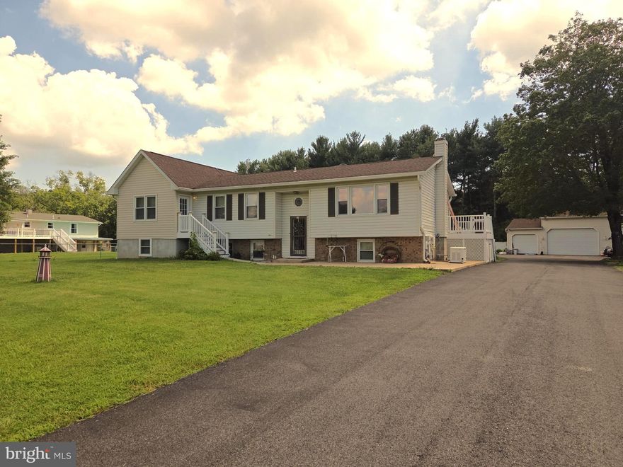 Great countryside property with endless possibilities.  This 4 bedroom, 2 and 1/2 bath split foyer home features a main floor in law suite. A huge sun room/kitchen great room that opens onto the covered swimming pool deck.  Radiant heat under the great room tile floors.   A large 40x24 detached garage with tons of storage space, and second floor loft.  A 20x10 Garden shed, 16 KW propane Whole House Backup generator, 38 Solar panels that are owned-not leased (approximately 15KW).  The lower level features 2 bedrooms a sitting room, office room  and large family room. Tax assessment square footage is incorrect. Sellers estimate 1700 sqft upstairs and 1500sqft downstairs.