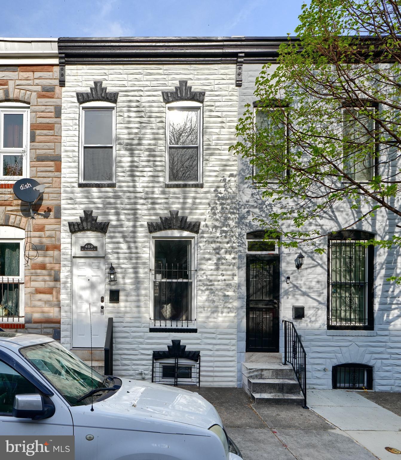 Less than 4 blocks from Patterson Park & in the neighborhood of Johns Hopkins Hospital, this beautifully renovated, open concept home qualifies for multiple grants so you can potentially buy with no money down! Enter through the digital keyless entry lock on the front door to the (1 of 3!) artistic wall that gives the home a modern edge! The kitchen Includes an extra touch of class with under cabinet AND island lights with remotes! Luxury Vinyl Plank flooring throughout, soft close cabinets, oversized granite island that fits 8 barstools & all the mechanicals, appliances, kitchen, 3 bathrooms & cosmetics are just over a year old with the a/c unit just added! The Upper level also has an office/bonus area with built in shelves & the lower level has a bedroom & bonus room to use however you choose that walks out to the back yard where you'll find a large deck fro relaxing & entertaining. You need to see for yourself, this is just a glimpse of the beauty - don't miss the opportunity! Furniture is not included and virtually staged pictures are labeled.