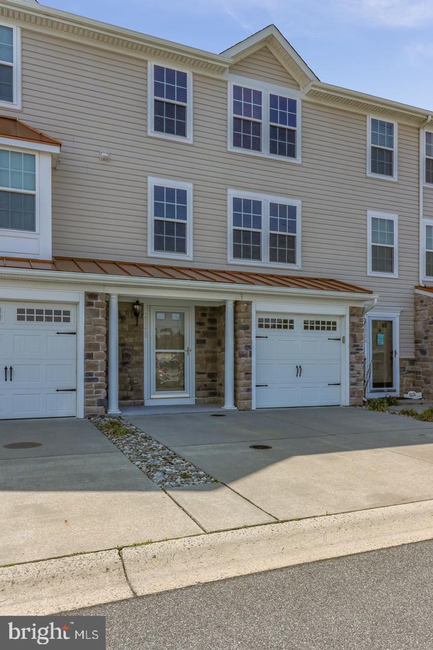 Welcome to this stylishly crafted 3-bedroom, 4-bath townhome in Victoria’s Landing, perfectly blending comfort and convenience. With attractive stone accents and curb appeal to spare, this three-level layout is enhanced by its convenience. The entry level offers a flexible recreation space, a half bath, laundry area,  along with an attached garage for parking and storage.  FRESH PAINT AND FLOORING ADD A NEW CONSTRUCTION FEEL. 

On the main floor, an open living area transitions seamlessly into the kitchen, featuring  a pantry,  and a bright breakfast nook. Step outside to a private deck —an ideal spot to enjoy colorful evening sunsets.

Upstairs, the primary suite impresses with a large walk-in closet, and spa-like en-suite bath complete with double vanities, a soaking tub, and separate shower. Two additional bedrooms, filled with natural light, share a full bath on this level.

Victoria’s Landing offers community perks including a pool and pool house just steps from your door, plus a nearby shopping center with grocery stores, dining, and everyday essentials. Located only 20 minutes from the beautiful beaches of Lewes and Rehoboth, this townhome delivers the perfect combination of coastal charm, accessibility, and modern living.