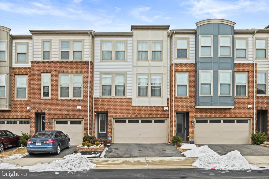 Your Dream Home Awaits: A Stunning, Light-Filled 3-Level Townhome. Welcome to 42368 Alder Forest Terrace! A rare chance to own a sophisticated 2018 Van Metre Home, nestled in the charming Glascock Field at Stone Ridge. Lovingly cared for by its original owners, this home perfectly balances tranquility, elegance, and functionality.

This spacious beautiful living design, nearly 2,600 sq ft offers 3 bedrooms, 3 full baths, 1 half bath, and a 2-car garage. Open views at the front and back, ensuring an abundance of natural light throughout.

The main level is an entertainer’s dream, with high ceilings, hardwood floors throughout including staircases, and an open floor plan. A gourmet kitchen with stainless steel appliances, a built-in microwave, a wall oven, an extended kitchen island, complete with elegant pendant lighting, offers ample space for meal prep, dining, and entertaining. The open floor plan seamlessly connects the sun-drenched living room—with its impressive wall of windows dressed in custom automated shades—to the formal dining area, creating a bright, inviting space. Step out from the kitchen onto a custom composite deck, perfect for al fresco dining. A cozy breakfast nook or home office space, along with a convenient half bath, completes the main level.

Upstairs, retreat to the serene primary suite, which features a tray ceiling, abundant natural light, a spacious walk-in closet, and ensuite bathroom with dual vanities, an upgraded frameless shower. Two generously sized secondary bedrooms, a full bathroom, and a convenient laundry closet round out the upper level.

The property features a professionally landscaped garden that sets a welcoming tone. Upon entering through the front door, secured with a Yale smart lock, you’ll find the lower walk-out level—a versatile recreation space perfect for relaxing, hosting movie nights, or entertaining guests. Complete with recessed lighting, a full bathroom, and a storage closet, this area also includes easy access to the garage. Step outside to the fenced rear stone patio, perfect for outdoor gatherings and BBQ.

Stone Ridge community offers exceptional amenities, including trails with pet-waste stations, three swimming pools, eight tot lots, three tennis courts, and a basketball court. The Nettle Mill clubhouse features a fitness center, a rentable event space, an outdoor patio, and an amphitheater perfect for hosting social events. The location is unbeatable—just 10 miles from Dulles International Airport, and major commuting routes.