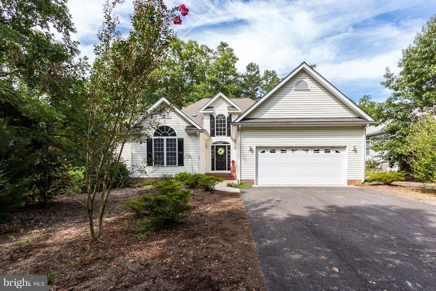 Stunning one level home. High ceilings, paladin windows and beautiful architectural details throughout this well cared for home. Light filled & bright. Gleaming hardwood floors, SS appliances  & island kitchen. Waterfront community, golf, tennis, marina, dock, pools, tennis, tot lots, soccer fields, security gate, club house & social activities to enjoy. Located near the main gate! Enjoy!