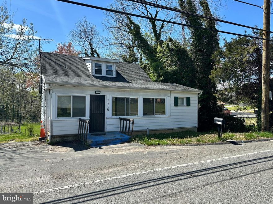 Cozy 2 Bedroom Rambler with potential for 3rd Bedroom. Large partially fenced rear yard with storage shed.  Lot size over 5900 sqft. Central A/C and heat.