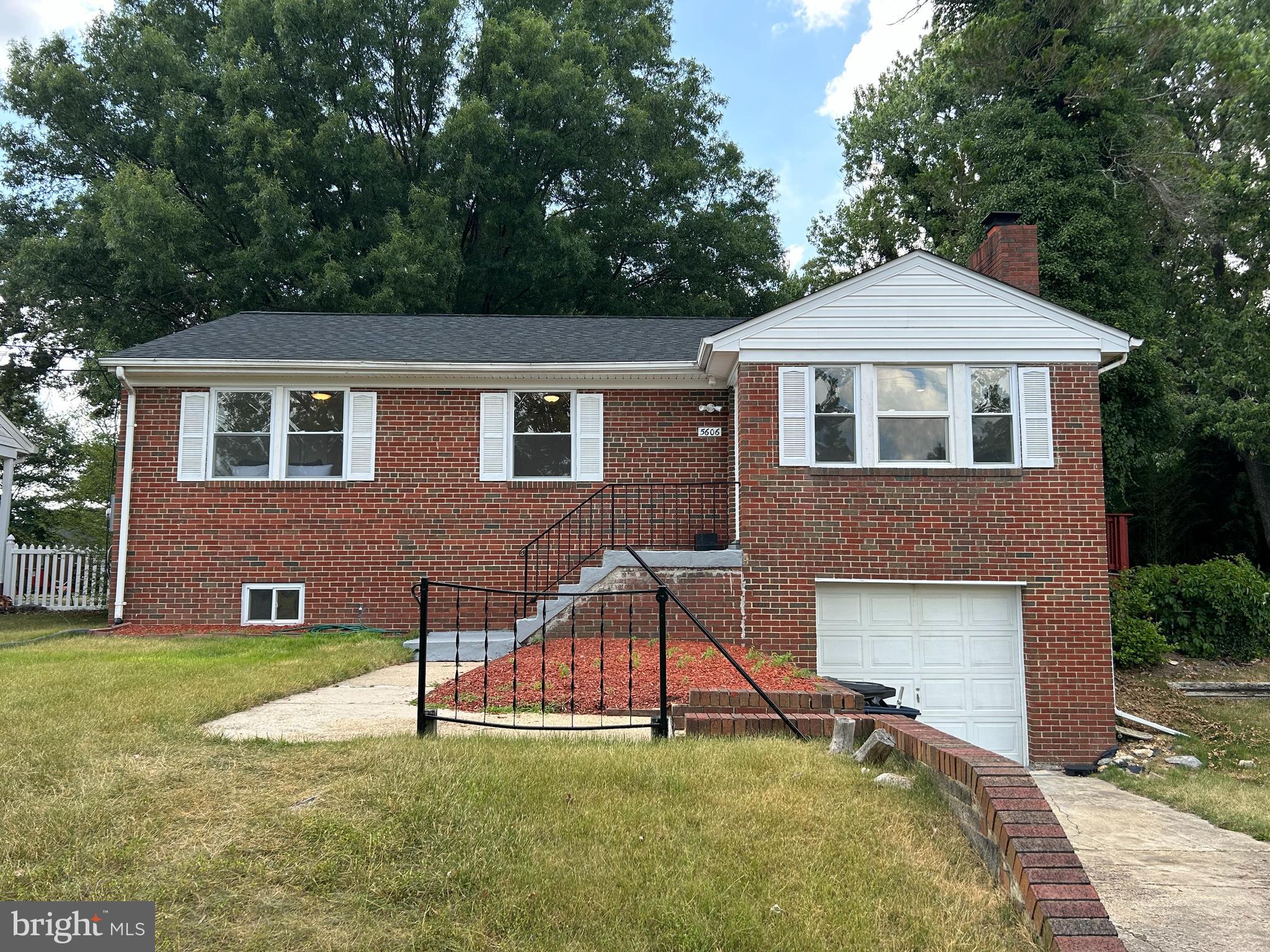 Welcome to your charming 4 Bedroom, 2 Full Bath, Ranch-style retreat in the heart of Temple Hills, Maryland. Renovated with a brand new roof, stainless appliances and carpet. On the main level, you have solid hardwood flooring, a cozy living room fireplace, a formal dining room, and recessed lighting. The updated kitchen comes with quartz countertops and stainless steel appliances. The main level also has the three bedrooms, and a bath that is freshly painted and updated, too. The lower level offers a second full bath, an additional bedroom/office, a large rec room, new carpet, and an laundry room with a new washer and dryer. A separate entrance/exit leads up to the backyard. The level backyard has a wooden deck. It's fully fenced-in, perfect for pets, cookouts, and entertaining. This home offers the best of both worlds with two levels of living space, providing flexibility and versatility to suit your lifestyle needs. A MUST SEE!