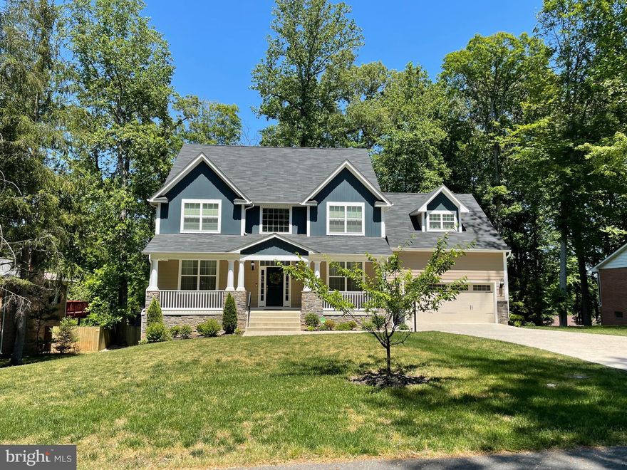 Stunning custom home better than new in Luxury Community of Graham Park Shores. Enjoy being surrounded by mature trees, stamped concrete driveway, extra large attached garage for 2 vehicles, large porch to enjoy summer, oak hardwood floor on entry with high moulding walls, office with moulding walls and sliding pocket doors, dining room with chair moulding walls and Buttler base cabinet area to get those snacks ready to serve, large kitchen with granite countertops, large aisle and SS appliances, breakfast area, kitchen desk, designer cabinets, laundry room with sink, principal bedroom with sitting room, custom sink on bathroom and walking closet,  spacious entertainment area in basement with full bath and storage room. This is a dream custom home just minutes to Quantico Base, I-95 and Route 1.