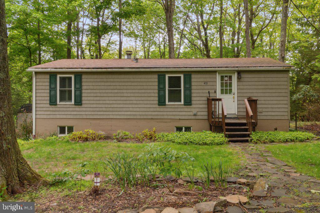 Nestled on a tranquil wooded hillside overlooking Deep Creek Lake, this charming home offers an exceptional opportunity for a private rural retreat while remaining close to the area’s best attractions. With delightful birdhouse accents, this cozy abode feels like your very own secluded nest. The recently updated kitchen is a culinary delight, making meal prep a breeze, while the newly renovated basement has been transformed into a spacious family room—perfect for movie nights, games, or simply relaxing. The living room, complete with a warm gas fireplace, is the ideal setting to unwind, with large windows framing picturesque views—perfect for enjoying a good book or your favorite TV show.
This property isn’t just a house; it’s a home filled with potential, ready to create cherished memories. Located just minutes from Wisp Resort, Deep Creek Lake State Park, Swallow Falls State Park, and Herrington Manor State Park, it offers endless outdoor activities. For dining, entertainment, and leisure, local eateries and a nearby movie theater are just a short drive away.
Significant updates have been made throughout the home, ensuring comfort and convenience. The basement boasts a fully renovated space with a separate laundry room adorned with stylish barn doors. Premium vinyl plank flooring, fresh paint, and a new slate tile pad for the pellet stove complete the modern updates. The water system has been upgraded with a new 800+ foot well, complete with a new pump and pressure tank. New fire safety casement windows have been installed in the main bedrooms for added peace of mind. The home is being sold fully furnished, and it comes with an active Temporary Vacation Rental Unit (TVRU) permit—perfect for those looking for immediate rental potential.
For year-round comfort, the property offers two additional heat sources in addition to the heat pump: a propane fireplace and wall heater in the basement, plus a pellet stove capable of heating the entire house. Whether you’re escaping for a weekend retreat or considering this home as a potential rental investment, it is ready to provide comfort, relaxation, and ample opportunities for adventure.
We encourage prospective buyers to rent the property for a weekend getaway to truly appreciate its tranquility and potential. Serious buyers are welcome to contact the Agent to arrange a private showing.
This property is an exceptional find, offering both personal enjoyment and profitable rental potential. We look forward to helping you explore this stunning home.