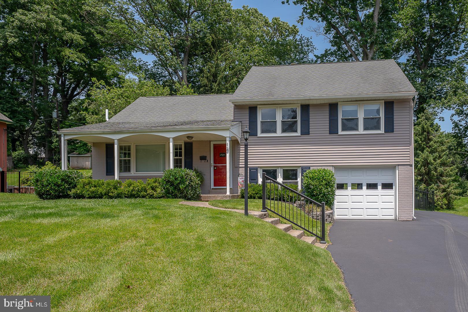 This lovely Malvern home offers an updated kitchen and counters, updated bathrooms, newer heating and airconditioning, portable generator, spacious deck a beautiful backyard complete with newer fencing, and large private driveway and garage! Step inside and marvel at the many main floor highlights, including large bay windows, recessed lighting and a seamless flow ideal for entertaining and daily living. The living spaces feature oversized windows, gleaming hardwood floors and gorgeous built-ins with glass shelving which opens to the renovated kitchen just beyond, with sparkling white cabinetry, Quartzite countertops, custom tile backsplash, counter seating, high end stainless steel appliances. From the Dining room, exit through the french door to dine alfresco on the beautiful newer deck with steps to the large manicured backyard with a luxury custom fence. On the second floor you’ll find a large primary bedroom, two secondary bedrooms and an updated hall bath which includes laundry area. The downstairs lower level boasts an inviting area for gathering and play, a full bathroom, and access to an oversized garage. The backyard is a dreamy oasis of expansive greenspace with a large newer rear deck just off the back of the home. In the award-winning Great Valley School District, this home sits mere minutes from premier shopping and dining, playgrounds, walking trails, transit and commuter routes. Move In Ready!