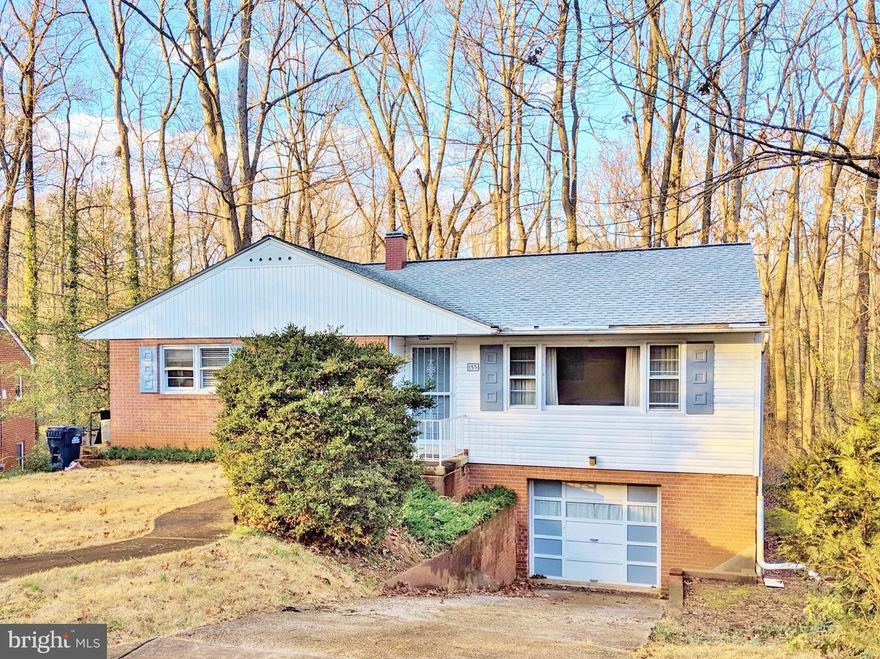 2-Story rambler in the sought-after Woodland Hills subdivision.  Oak hardwood flooring throughout main level with opened kitchen & granite counters.  RARE built-in garage on lower level.  Wooded backyard backs to open parkland and paved path to Roosevelt Center. Just a short jaunt to groceries, theater, aquatic & community centers, restaurants, salons, bakery, banking & more.