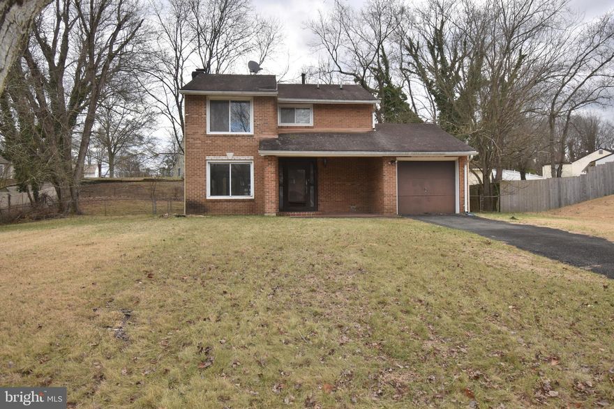 Two story Colonial style home with integral garage on a nice lot.  There is a step down living room with fireplace.  All bedrooms are located on the upper level. Property sold strictly as is.  Some discoloration present in the furnace and utility room.  Use caution on the screened in patio.