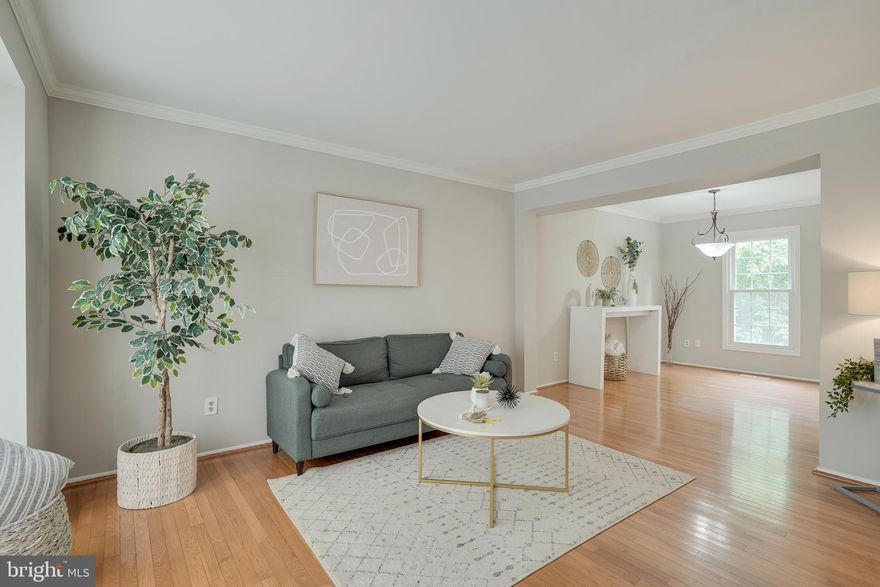 Beautiful 3 levels upgraded Townhouse. This freshly painted spacious home features 3 Bedrooms, 2.5 baths, updated kitchen with granite, master bedroom suite with a walk-in closet. Spacious bedroom with share full bathroom, all hardwood main and upper level, walkout basement.  Fenced back yard. Community with swimming pool. Great location minutes from shopping, restaurants, major highways.  It is a must-see home! MOVE-IN READY.