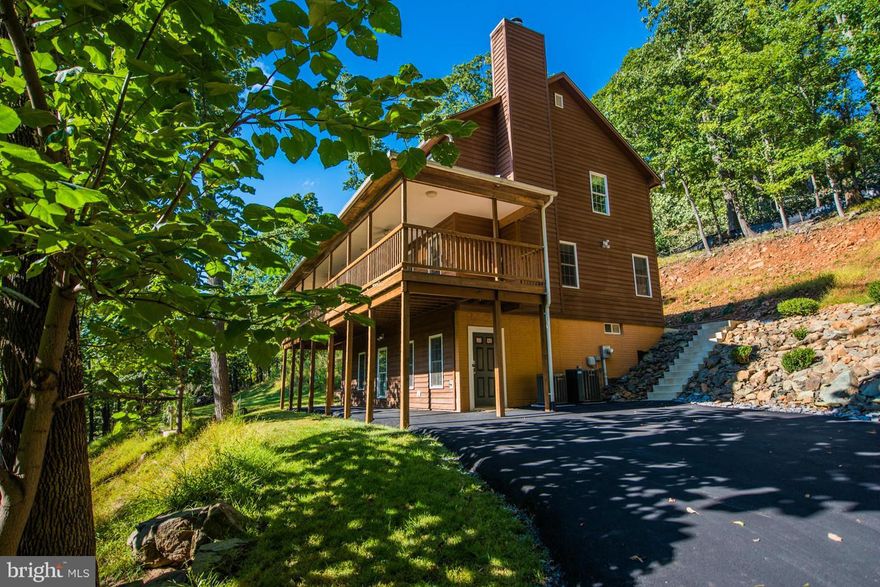 Loaded w/ recent improvements! 4B, 2.5 bath towards bottom of High Knob! Winter Views from your wrap-around deck! Private, new concrete rear patio, stairs & natural rock landscape. New paved driveway/walkway under deck. New SS appliances. Wood & Tile floors, Stone FP, custom built-in's w/cushion seats. Spacious Bedrooms, full basement w/walk out. Perfect for week-end get-away or full time living!