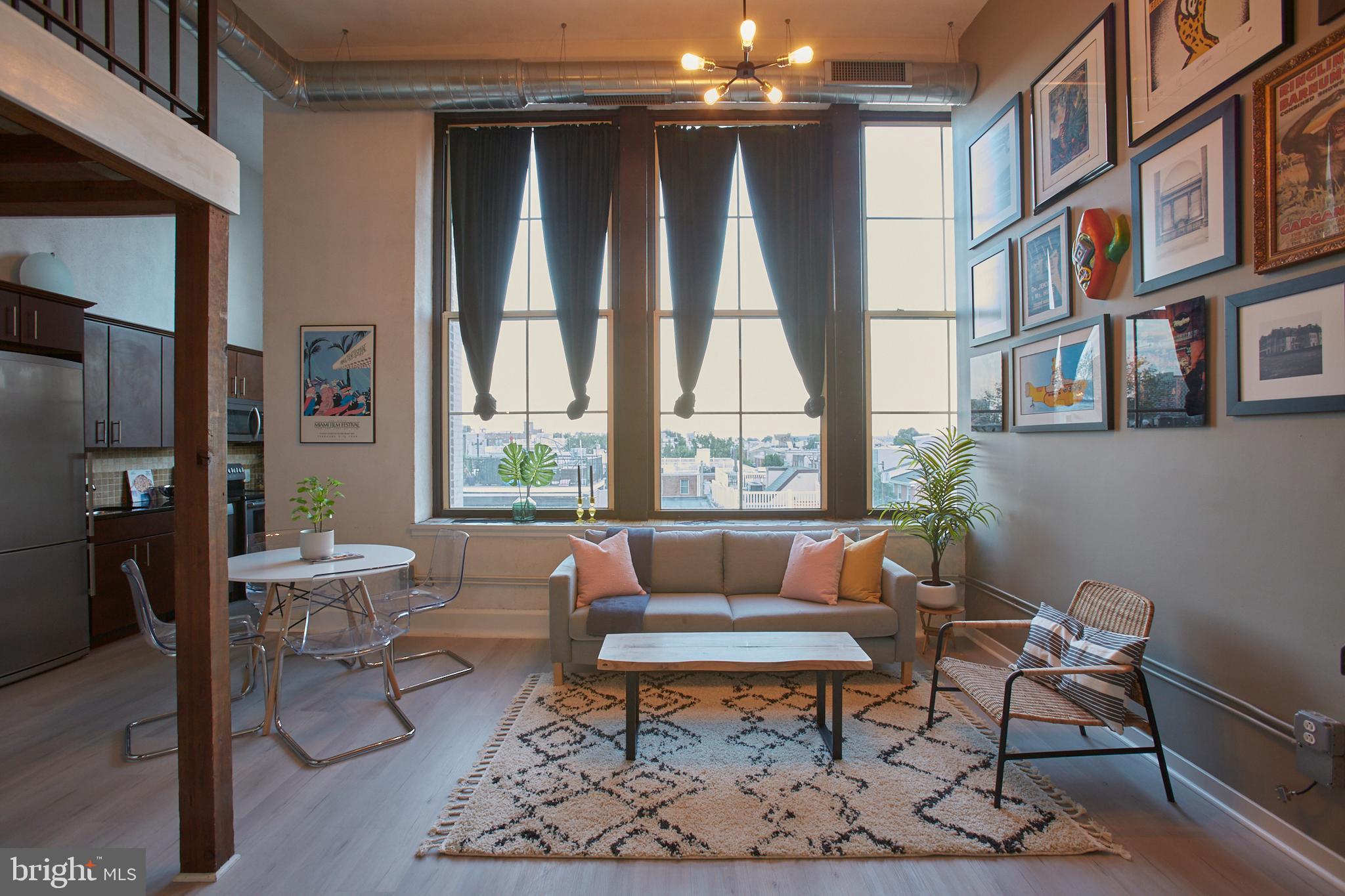 This bright and airy top floor modern loft in the Hawthorne Lofts building offers style and amenities in a convenient location. The building, originally a school, is historically designated and maintains original architectural details that add warmth in contrast to modern loft styling. This unit features an open plan main living area with high ceilings, a great wall for displaying your art collection, and huge east- and south-facing windows with a beautiful mosaic sill. New gray-wash floors were installed in 2018, and the original wood schoolhouse floors are intact beneath if you prefer. Stainless steel Bosch appliances and granite countertops anchor the kitchen, which has space for a bar cart or prep station. Upstairs in the loft is plenty of space for an office, bedroom, and dressing area with walk-in closet. There is no shortage of storage in this unit, with three closets, under stair storage, and built in storage both in the loft and the full bathroom. The pet-friendly building also offers one of the largest roof decks with 360 views, a fully equipped gym, dry and steam saunas, and a common room with billiards table, all included in the low condo fee, and tax abated through December 2020. The location is convenient to parks for dog walking; grocery shopping at Whole Foods, Acme or the Italian Market; gyms; restaurants like Hawthorne s, Sabrina s, and Ralph s; coffee at Chapterhouse, Function Coffee Labs, and Starbucks; and is walkable to offerings in East Passyunk, Queen Village, and Center City.