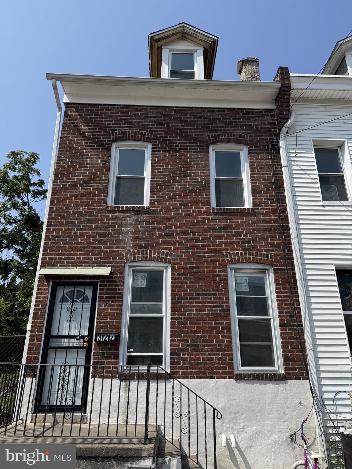 Recently updated end of row townhouse. This home has mostly new paint, flooring and recent windows. This home has tons of natural light. Enter through the front door to the newly painted living room. Behind the living is an also newly painted, and large dining room. The kitchen is behind the dining room and has a brand new stove. The kitchen also features hook up's for a washer and dryer. Out the back door is an extremely deep, fenced in yard just waiting for you to have your gatherings there or maybe potential for a drive way/parking pad accessed through the rear alley way. The 2nd floor is again filled with sunlight, has 2 nicely sized bedrooms and the full hall bath (huge). The 3rd floor has the other 2 bedrooms with dormer windows drenching the rooms in sunlight. Book your showing today.