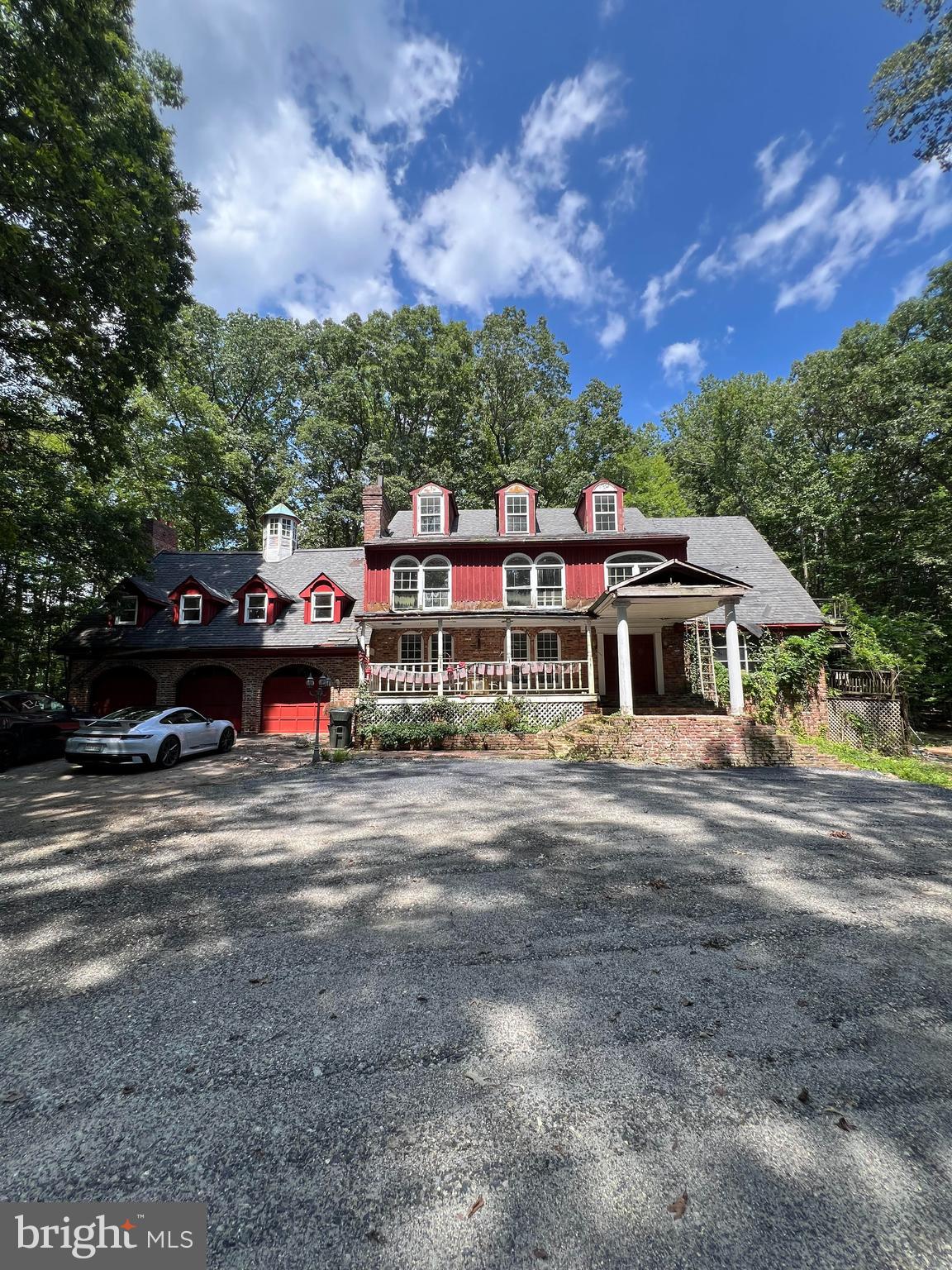 Experience the perfect blend of privacy, nature, and convenience with this spacious 4-bedroom, 3.5-bath Craftsman-style home, offering 3,846 square feet of living space nestled on 5.05 secluded wooded acres in the scenic equestrian countryside of Fairfax Station, Virginia. Located just outside the Washington, D.C. beltway, this property is ideal for those seeking a peaceful retreat with easy access to urban amenities. Please note that the home is being sold in as-is condition and will require significant renovation—perfect for buyers looking to customize and invest in their dream space.
Set in the heart of the coveted Foxfire community, this home provides a rare opportunity to enjoy a serene, nature-filled lifestyle without sacrificing proximity to key commuting routes. With quick access to Route 123, the Fairfax County Parkway, I-95, and I-66, travel to downtown D.C., the Northern Virginia tech corridor, and surrounding areas is remarkably convenient. Both Reagan National and Washington Dulles airports are within reach, as are public transit options including the Springfield Metro and Burke VRE stations.
The area’s natural beauty is one of its greatest assets. Fairfax Station is known for its rolling hills and lush greenery, and this property embodies that spirit. Just minutes away, Fountainhead Regional Park offers a wealth of outdoor recreation, including hiking, biking, horseback riding, boating, fishing, and picnicking. Whether you're an avid outdoor enthusiast or simply enjoy the occasional escape into nature, this location delivers.
Beyond the tranquility, you’ll find top-rated Fairfax County schools, nearby shopping, dining, and entertainment in Burke, Lorton, and the charming historic towns of Occoquan and Clifton. This property offers a unique combination of rural ambiance and suburban accessibility, providing an ideal backdrop for daily living or weekend unwinding.
Whether you're drawn by the promise of a nature-filled lifestyle, the potential of a spacious home on a large private lot, or the ease of commuting to the D.C. metro area, this Fairfax Station gem is a rare find. Come see the possibilities and imagine turning this peaceful retreat into your personalized sanctuary.