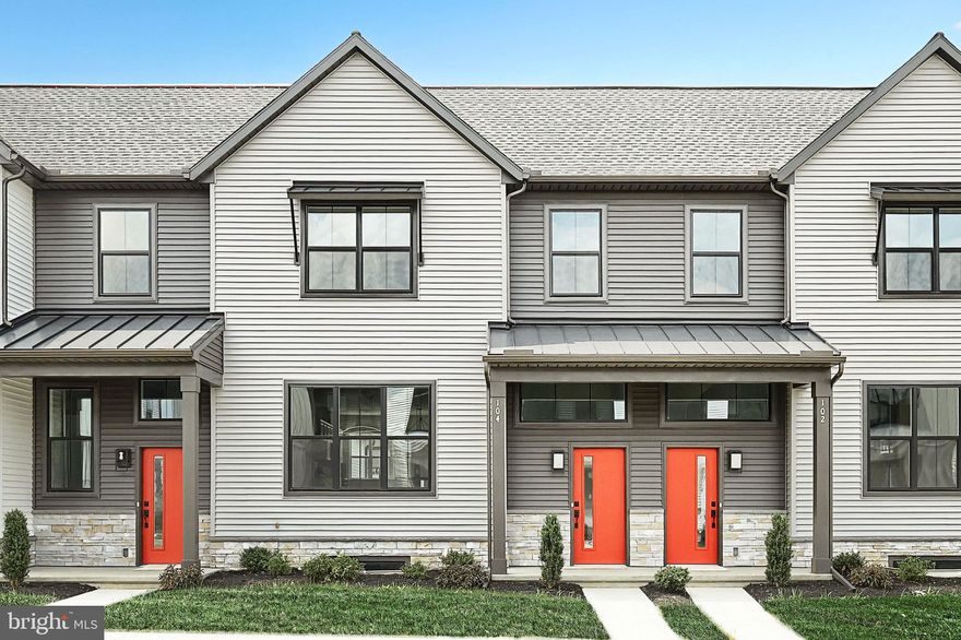 This 2-story townhome includes a 1-car, rear load garage with mudroom entry, 9’ ceilings on the first floor, and a patio for outdoor living. The kitchen is well equipped with stainless steel appliances, attractive cabinetry, and quartz countertops with a tile backsplash. The kitchen opens to a spacious dining area and then a sunny living room. The 2nd floor owners suite features an expansive closet, and a private bathroom with a double bowl vanity and 5’ shower. Adjacent to the suite are 2 additional bedrooms, a full bathroom, and a convenient laundry room.