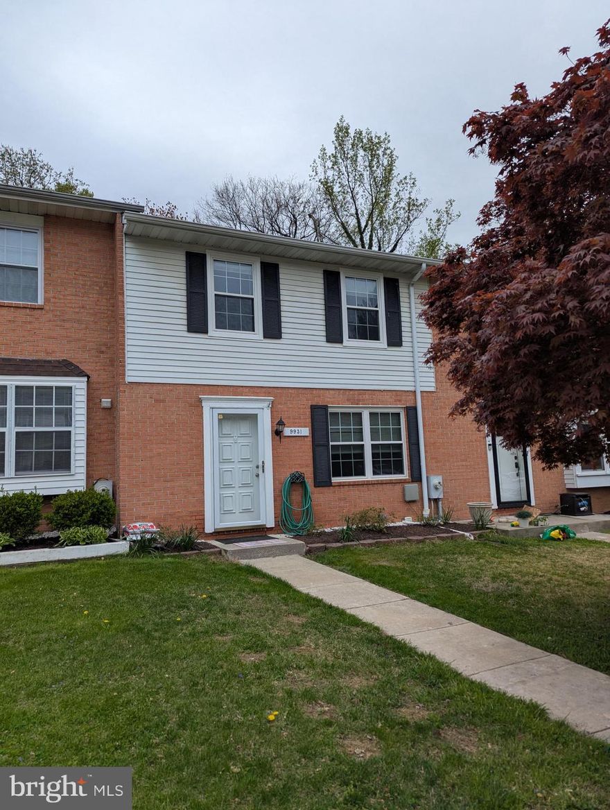 VILLAGE OF NEARBROOK IN CARNEY TO CALL HOME! A great updated townhome among single family homes tucked away!  Beautiful hardwoods on the main level, new kitchen with white cabinetry, and stainless steel appliances. Sliding glass doors off the dining room to a huge composite deck with a cathedral ceiling roof overlooking woods and a stream! Primary bedroom with its own half bath and a full updated hall bath.  Pull down attic stairs for more storage, and neutral carpet on the stairs and upper level. 
Huge finished lower level with ceramic tile flooring, a full bath with a tub/shower combo, laundry room and sliding glass doors to a patio/yard.  Apply on line! Application fee $55 per person responsible for rent.