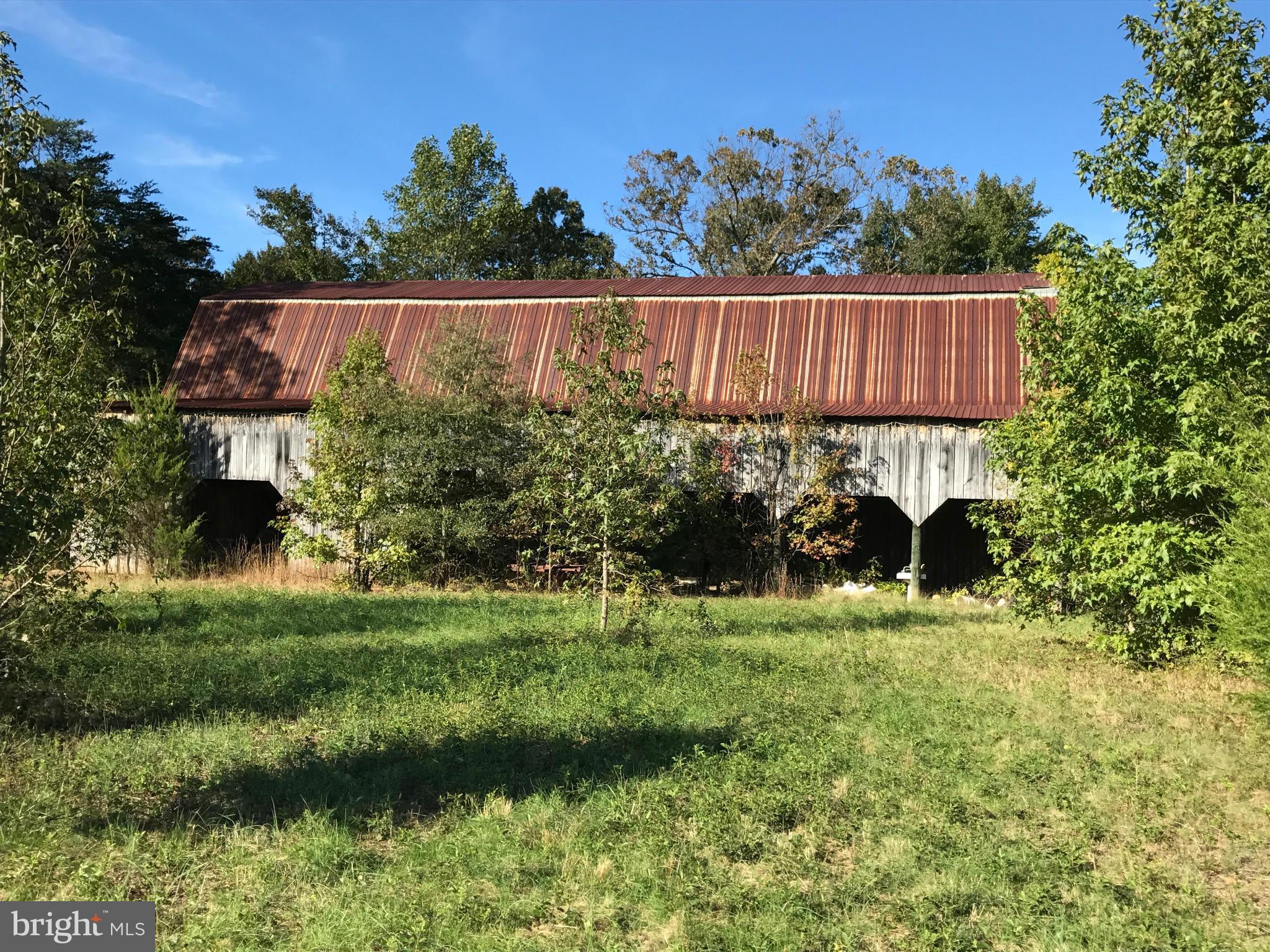 Bring your Horse, cows, pigs and Chickens, build the home you have always wanted on this prime flat cleared property just minutes from town, the Barn has stalls, for live stock, a great little farmette.