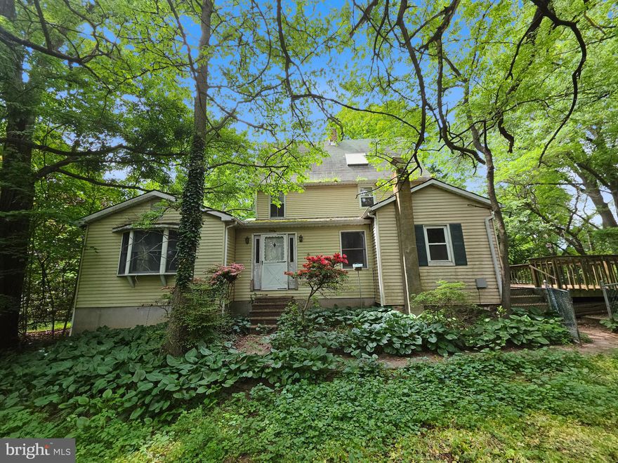 Nestled in the peaceful Glen Arm section of Baltimore County, this extraordinary property offers a rare opportunity to restore and reimagine a truly unique estate. Set on nearly 5 private acres surrounded by mature trees, the home delivers exceptional space, character, and endless potential for renovation enthusiasts, investors, or buyers seeking a secluded retreat.

Boasting approximately 3,000 square feet of living space across five levels — including a finished attic — the residence features generously sized rooms and a flexible layout ready for your vision. The expansive primary suite includes a private full bath and access to its own deck overlooking the serene wooded setting. Additional highlights include a full basement, a sunroom off the family room, a kitchen with table space, multiple outdoor decks, and a detached storage unit.

Rich with character and history, this previously celebrity-owned home presents a rare chance to create something truly special in a highly desirable and tranquil location. Whether transformed into a private estate, weekend retreat, or showcase renovation project, the possibilities are exceptional.

An extraordinary find with unlimited potential.