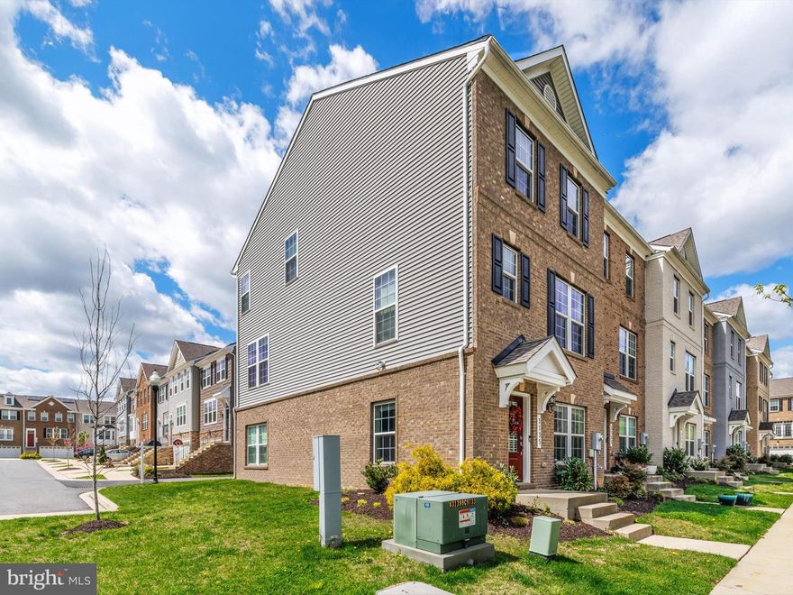 Discover this exceptional Perry model townhome, a unique gem situated at the peaceful rear of the Metro Pointe community. This rare find is adjacent to a historic estate, offering enduring privacy and protected lush green views. Meticulously cared for by its original owner, this home boasts carefully selected upgrades by an interior designer, enhancing both its style and functionality. As a quiet end unit, it benefits from abundant natural light, enhanced privacy, and a serene atmosphere.

Inside, you'll find a spacious entry-level living room, perfect for welcoming guests or unwinding after a busy day, along with a convenient powder room on the same floor. The open-concept second level features a stunning designer kitchen with stainless steel appliances, double wall ovens, a built-in cooktop, and sleek finishes, seamlessly transitioning into a bright dining area and cozy living space, ideal for everyday living or entertaining. Step out onto the balcony off the kitchen to enjoy your morning coffee or catch the last of the evening sun.

The luxurious third-floor primary suite includes an en-suite bath, complemented by two additional bedrooms, a full bath, and a convenient upper-level laundry. A rear-facing 2-car garage completes this wonderful home.

The location is unbeatable, just minutes from Landover Metro, New Carrollton (Amtrak, MARC & future Purple Line), and offers easy access to DC via the Beltway. This home is truly special—designer-finished, ideally situated, and lovingly maintained. Don't miss your chance to own one of the best lots in the neighborhood!